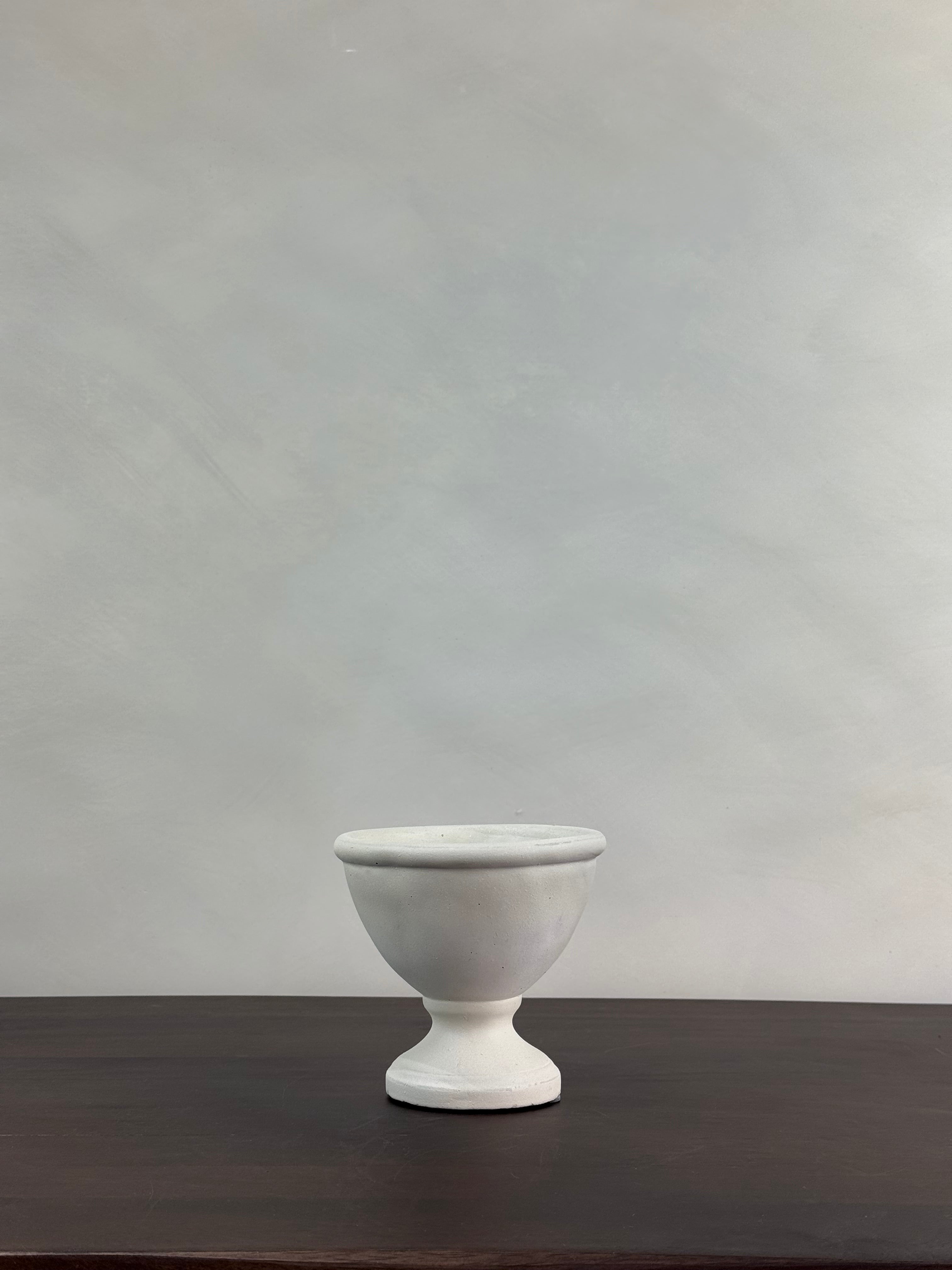 WHITE PEDESTAL VESSEL